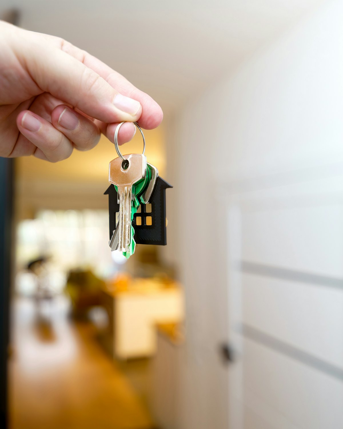 House keys being handed over at a front door